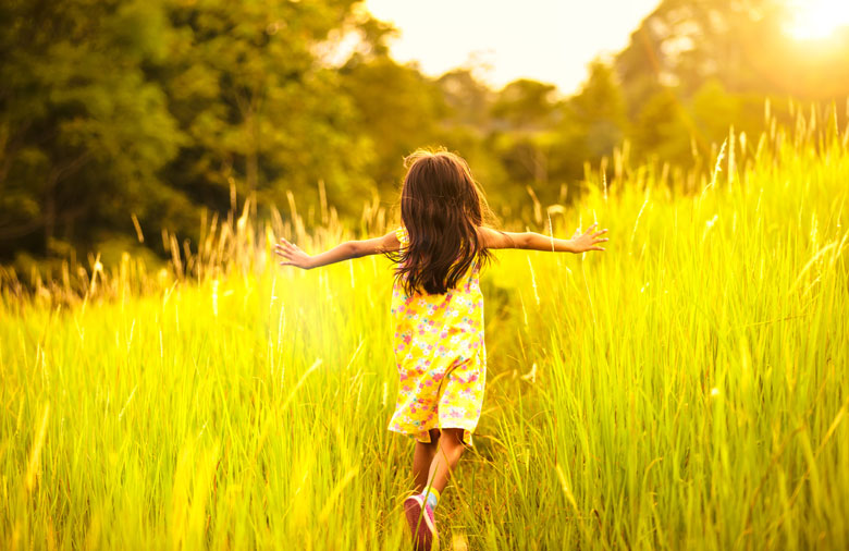 little-girl-running-through-weeds